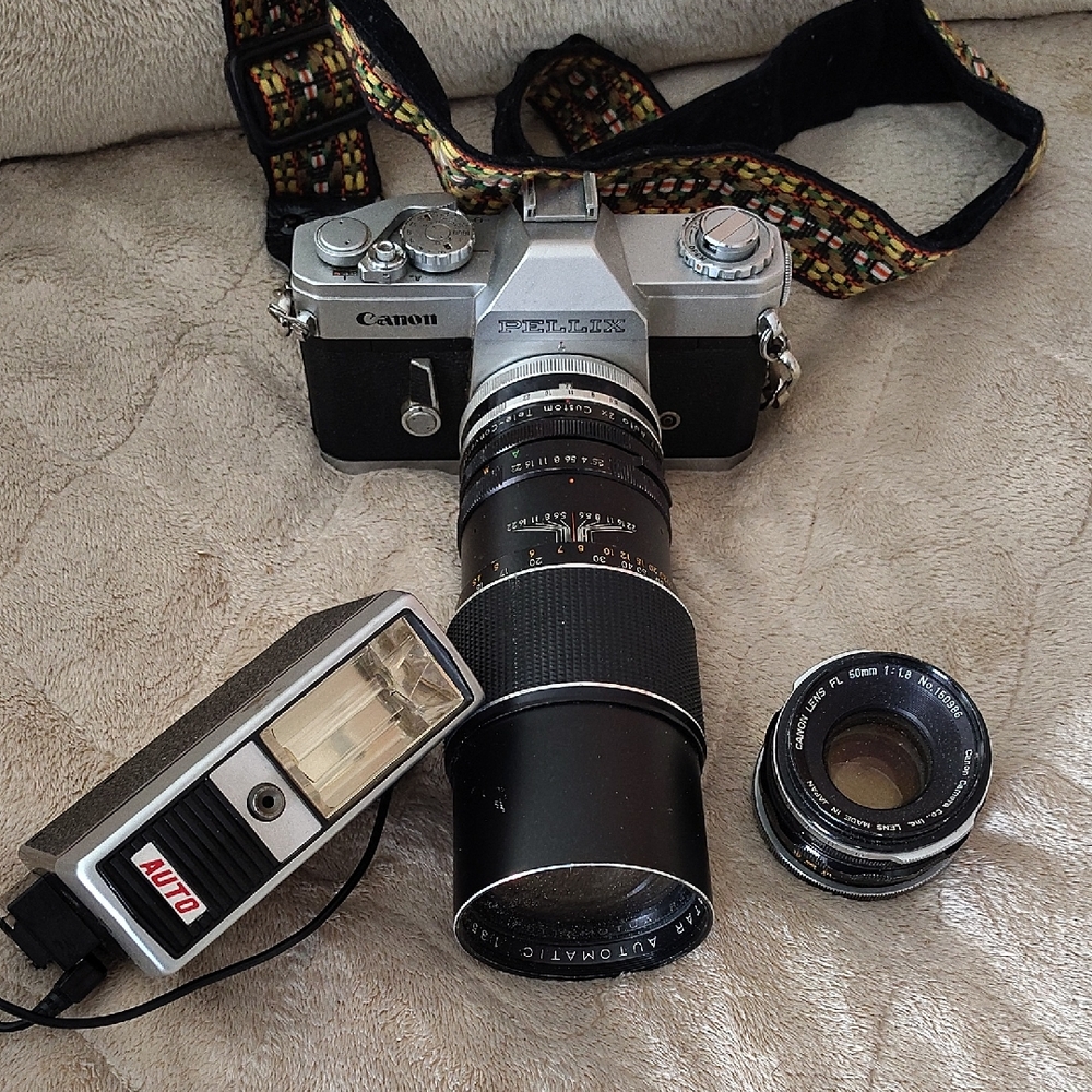 Canon Silver and Black Film Camera with Accessories